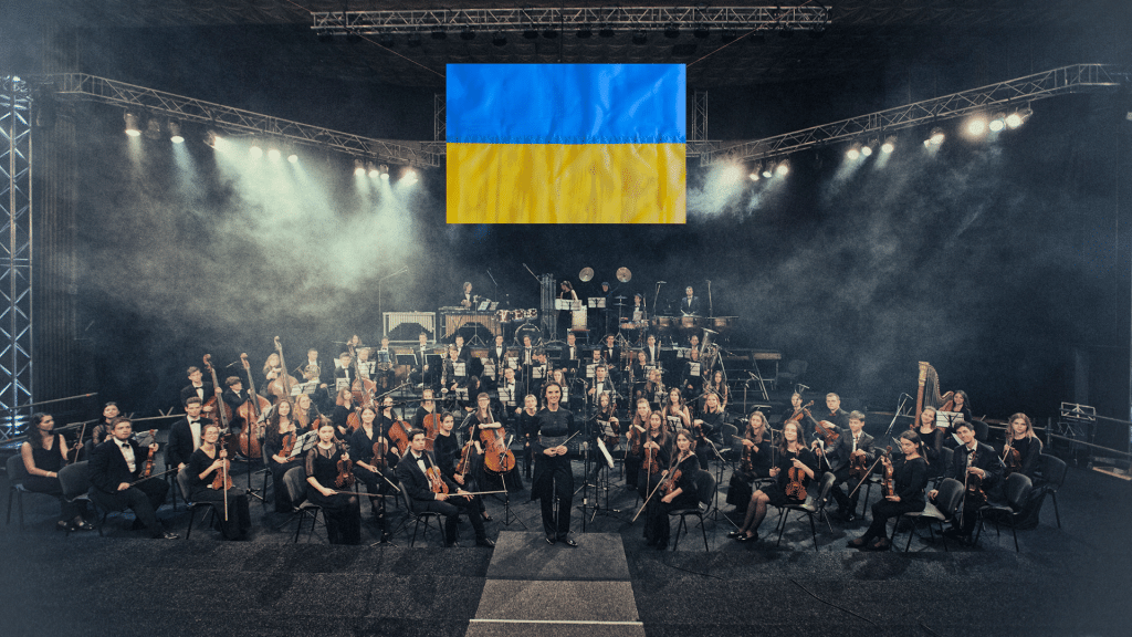 Youth Symphony orchestra of Ucraine with the ucraine flag